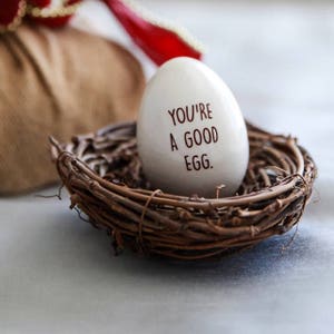 This Easter egg would be a unique Easter gift for any friend, family, co-worker or loved one. Can be used as an adorable easter basket stuffer. The front says 'You're a Good Egg' and the back says 'Thanks for being my friend'