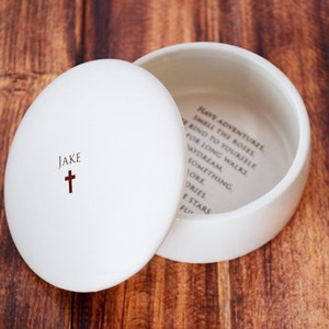 This lovely round keepsake box would be a perfect baptism, christening, first communion, or confirmation gift. It can be personalized with a name and custom message.