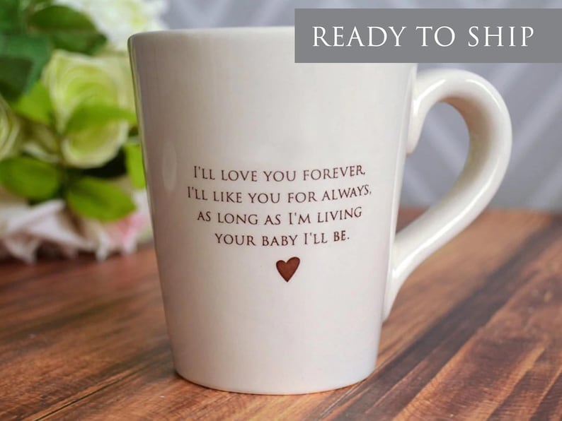 This sweet ceramic mug would be a perfect Mothers Day gift. It's made of earthenware clay and has this text printed on it: I'll Love You Forever, I'll Like You for Always, As Long as I'm Living Your Baby I'll Be.
