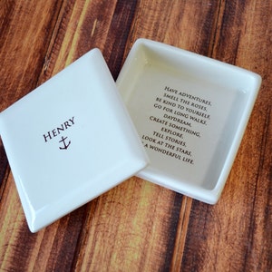 This lovely square keepsake box would be a perfect baptism, christening, first communion, or confirmation gift. It has an have adventures prayer and can be personalized.