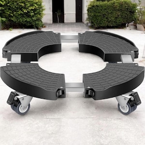 May include: A black adjustable plant caddy featuring four curved corner segments with a textured grid pattern, connected by silver metal bars. The base is supported by four swivel caster wheels, each equipped with a locking mechanism for stability.