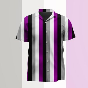 May include: A short-sleeved button-down shirt featuring a vertical striped pattern in alternating colors of purple, black, white, and various shades of gray. The garment has a classic collar, a front button placket, and a straight hemline.