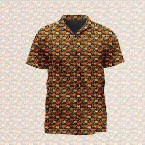 May include: A short-sleeved button-down shirt featuring an all-over repeating pattern of orange pumpkins and small yellow flowers set against a dark black background. The garment includes a classic collar and a vertical row of black buttons.