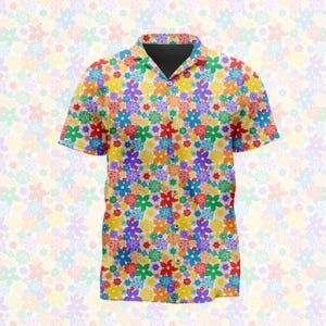 Pode incluir: Uma camisa de manga curta com botões e um padrão floral vibrante em toda a peça, com flores de vários tamanhos em tons de azul, amarelo, laranja, vermelho, roxo e verde. A camisa apresenta um colarinho clássico e um interior de gola escuro.