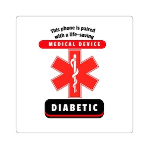 May include: A square sticker with a white background featuring a red Star of Life symbol with a white serpent and staff. Above the symbol, black text reads: This phone is paired with a life-saving MEDICAL DEVICE. Below, the word DIABETIC is in white.