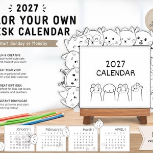 May include: A 2027 color your own desk calendar featuring black and white line art of cats surrounding a central square with the text 2027 CALENDAR and cat paws. Includes monthly calendar pages for January through April and a wooden stand.