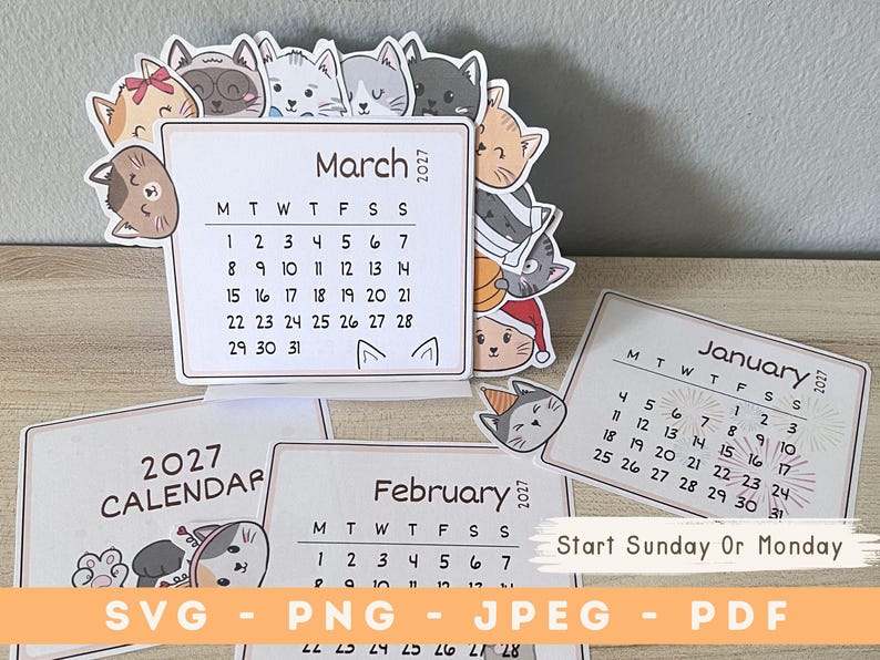 May include: A 2027 desk calendar set featuring illustrated cat faces around the borders. The March page is displayed upright, showing a grid with dates from 1 to 31. Additional pages for January and February are visible, along with text indicating file formats SVG, PNG, JPEG, and PDF.
