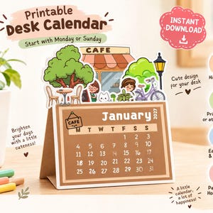 May include: A printable desk calendar for January 2027 with a brown background and white text. The top features a die-cut illustration of a cafe scene with a tree, a bicycle, and people. The calendar includes text labels like Printable Desk Calendar, Instant Download, and instructions for printing and assembly.