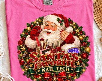 May include: A bright pink t-shirt featuring a graphic of Santa Claus surrounded by a Christmas wreath. Santa is holding nail polish bottles and brushes, with a UV nail lamp nearby. The text reads SANTA'S FAVORITE NAIL TECH.