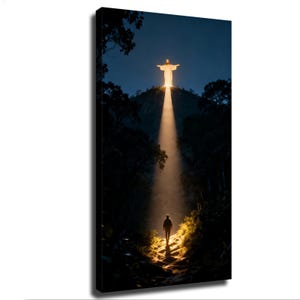 May include: A vertical canvas print depicting a glowing white statue of a figure with outstretched arms atop a dark mountain peak at night. A bright beam of light shines downward from the statue onto a lone person walking along a path below.