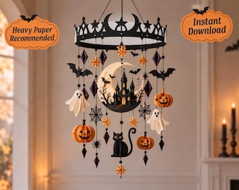 May include: A Halloween-themed hanging mobile featuring a black crown-shaped frame with dangling paper cutouts of a crescent moon with a castle, ghosts, jack-o'-lanterns, a black cat, bats, spiders, and stars. Text reads Heavy Paper Recommended and Instant Download.