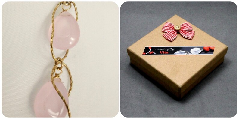 May include: A pink rose quartz necklace with gold wire wrapping. The necklace is packaged in a brown box with a red and white gingham bow and a label that reads "Jewelry By Vita".