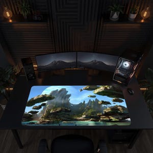 May include: A rectangular desk mat featuring a high-resolution print of a surreal landscape with floating rock formations, lush greenery, and a turquoise body of water under a bright sky, positioned on a black desk surface in a dark room.