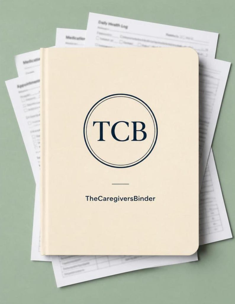 Puede incluir: Una carpeta de color crema con esquinas redondeadas que presenta un logotipo circular azul oscuro con las letras TCB. Debajo del logotipo, el texto dice TheCaregiversBinder. La carpeta est&aacute; colocada sobre varios formularios m&eacute;dicos impresos.