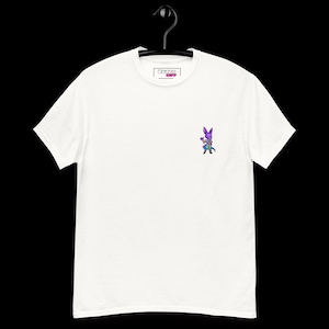 May include: A white short-sleeve t-shirt featuring a small, colorful pixel-art style graphic of a purple cat-like character on the left chest. The inner neck label displays the text Retro Kiff. The shirt is displayed on a black plastic hanger.
