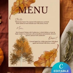 May include: A rectangular menu card with a cream background featuring dark brown text and watercolour illustrations of autumn leaves and a tree. The text includes headings for Starter, Main, and Dessert, with a blue circular badge stating Editable in Canva.