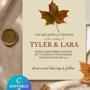 May include: A cream-colored wedding invitation card featuring a brown maple leaf graphic and text that reads: YOU ARE JOYFULLY INVITED to the wedding of TYLER & LARA SUNDAY.SEPTEMBER MTH.S027 AT 7 O'CLOCK IN THE EVENING THE TAYLOR HOUSE, LA dinner and dancing to follow.