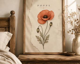 May include: A framed botanical art print featuring a detailed illustration of a single orange poppy flower with buds and leaves on a cream-coloured background. The text "P O P P Y" is printed in black at the top centre of the paper, which has a torn edge.