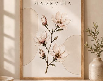 May include: A framed wall art print featuring a botanical illustration of a magnolia branch with pale pink flowers and buds. The background is a neutral cream colour with thin gold-toned line art circles. The word MAGNOLIA is printed at the top.