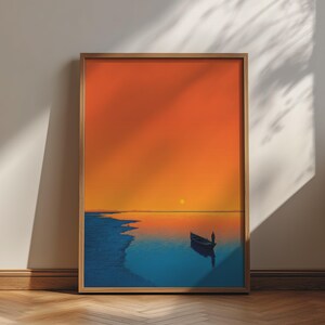 May include: A framed vertical wall art print depicting a serene sunset over a calm body of water. The scene features a vibrant orange sky, a small dark boat with a single figure, and a deep blue shoreline reflecting the warm light of the sun.