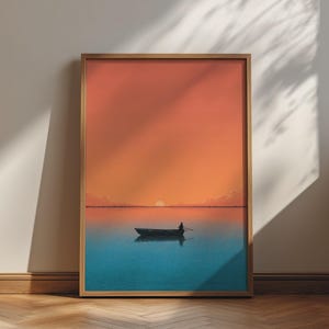 May include: A framed wall art print featuring a minimalist landscape illustration of a small rowboat with a single figure on calm water under a vibrant orange sunset sky, enclosed in a simple light-toned wooden frame with a clean rectangular border.