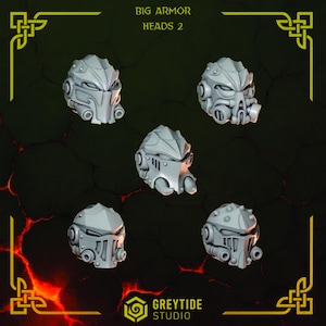 May include: Five grey miniature armor heads with distinct mechanical designs, including vents, visors, and circular ear pieces. The text BIG ARMOR HEADS 2 and GREYTIDE STUDIO is visible. These detailed components feature sharp ridges and geometric plating.