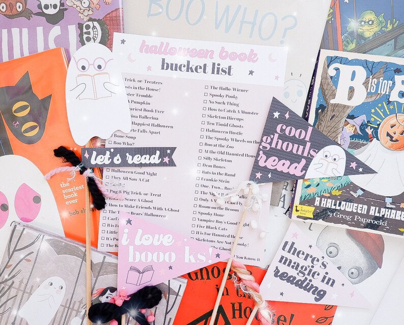 May include: A collection of Halloween-themed book-related items, including a pink and black "I love books" sign, a gray ghost with the text "cool ghouls read", and a pink and black "let's read" sign. There is also a white and black book with the text "the scariest book ever" and a pink and black checklist with the text "halloween book bucket list".