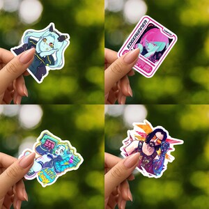 May include: A set of four vinyl stickers featuring anime-style characters and graphic designs. One sticker shows a character with light blue hair, another displays a pink-toned Edgerunner graphic, a third depicts a character with the text Later Choom, and the fourth shows a bearded character with sunglasses.