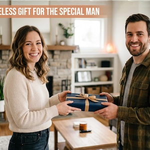 May include: A rectangular gift box wrapped in dark blue paper with a gold ribbon tied in a bow. The text A TIMELESS GIFT FOR THE SPECIAL MAN is printed in white on a light brown banner at the top of the image.