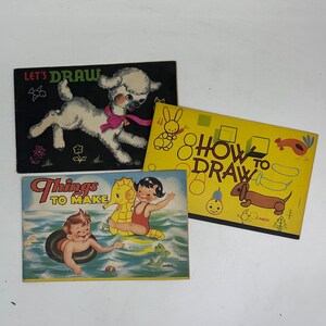 May include: Three vintage children's drawing books with colorful covers. The first book is black with a white poodle and the text "Let's Draw". The second book is yellow with the text "How to Draw" and various illustrations. The third book is blue with the text "Things to Make" and a child swimming with a seahorse.