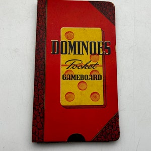 May include: A red and black cardboard box with the words "Dominoes Pocket Gameboard" printed on the front. The box features a yellow domino with five dots.