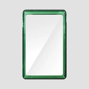 May include: A rectangular mirror featuring a translucent emerald green frame with a subtle glitter finish. The mirror has a smooth, reflective glass surface set within a thick, molded border that creates a clean, geometric profile for the object.