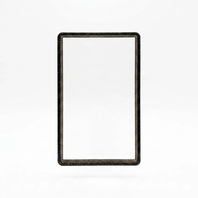 May include: A rectangular frame with rounded corners, featuring a dark black finish with subtle, light-colored speckles throughout the material. The frame has a clean, hollow center and a smooth, consistent border design around the entire perimeter.