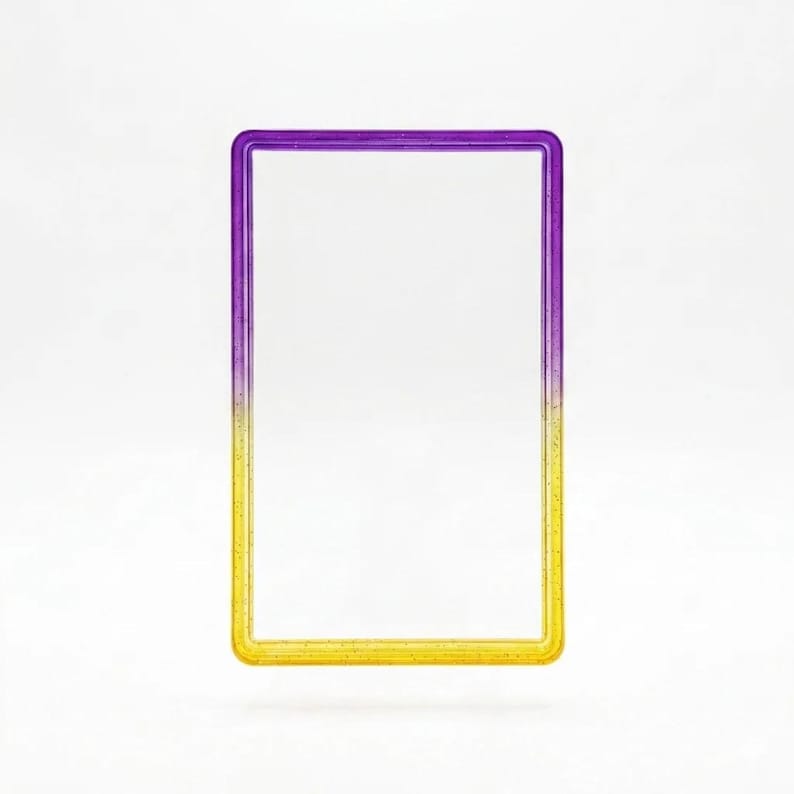 May include: A rectangular frame with rounded corners featuring a smooth gradient transition from a deep purple at the top to a bright yellow at the bottom. The frame has a subtle glittery texture embedded within the material throughout the surface.