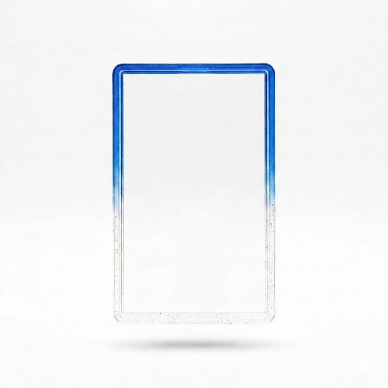 May include: A rectangular card holder frame featuring a blue gradient color scheme that transitions from a deep blue at the top to a clear, transparent base. The frame has a smooth, glossy finish with subtle embedded glitter particles throughout.