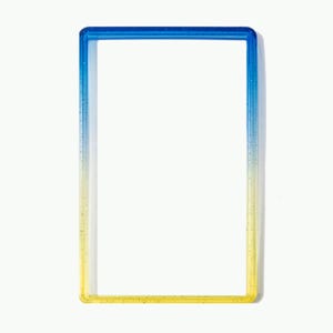 May include: A rectangular frame with a smooth, glossy finish featuring a vertical color gradient that transitions from a deep blue at the top to a bright yellow at the bottom. The frame has a hollow center and contains subtle glitter particles.