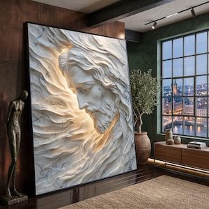 Peut inclure: Une grande œuvre d'art murale rectangulaire présentant un bas-relief en marbre blanc en trois dimensions représentant un visage aux cheveux fluides. L'œuvre est éclairée par l'arrière, créant une lueur douce qui souligne les textures sculptées.