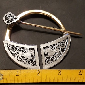 Extra Large Penannular with Celtic Horses .