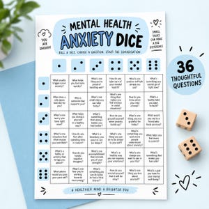 May include: A white game sheet titled Mental Health Anxiety Dice with a grid of 36 questions, light blue accents, and two wooden dice. The text includes instructions to roll a dice, choose a question, and start the conversation, plus 36 thoughtful questions.