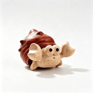 May include: A wooden crab figurine featuring a dark reddish-brown shell with a textured grain and a light beige body. The crab has two large, rounded eyes with black pupils, two raised claws, and a small mouth, all carved from smooth light wood.