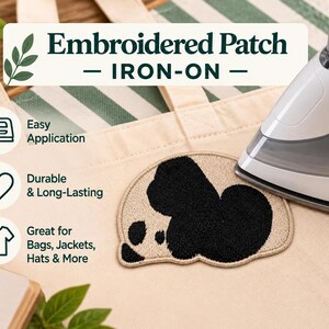 May include: An iron-on embroidered patch featuring a black and beige panda design on a canvas tote bag. The image includes text: Embroidered Patch IRON-ON, Easy Application, Durable & Long-Lasting, Great for Bags, Jackets, Hats & More, Small Patches Big Joy.