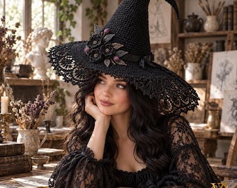 May include: A black crocheted witch hat featuring a wide brim with intricate lace detailing, adorned with a cluster of dark fabric flowers and leaves on the side, and a smooth black ribbon band tied in a small bow at the base of the pointed crown.