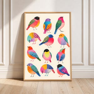May include: A framed art print featuring twelve stylized birds arranged in a grid. Each bird is rendered in vibrant, saturated colors including pink, blue, yellow, and green, with distinct patterns on their wings and bodies against a cream background.