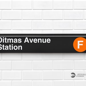 May include: Black and white sign with white text that reads "Ditmas Avenue Station" and a white "F" in an orange circle. The sign has a small "MTA" logo with the text "Officially Licensed" below it.
