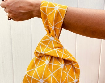 Japanese reversible wristlet knot bag
