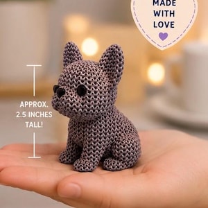May include: A 3D printed French Bulldog figurine with a textured surface resembling crochet stitches. The figure is grey with black eyes and stands approximately 2.5 inches tall. Text on the image includes 3D PRINTED CROCHET FRENCH BULLDOG, MADE WITH LOVE, HIGH QUALITY 3D PRINTED, DURABLE & LONG LASTING, and PERFECT GIFT FOR FRENCHIE LOVERS.