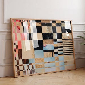 May include: A rectangular framed wall art piece featuring a collage of abstract geometric patterns, including black and white checkerboard squares, horizontal stripes, and sections of light blue, tan, and coral pink colours within a light wood frame.