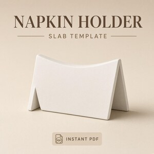 May include: A white napkin holder slab template with a curved top edge. The text NAPKIN HOLDER SLAB TEMPLATE is printed in dark brown above the object, and a rectangular label with a PDF icon and the text INSTANT PDF is below the object.