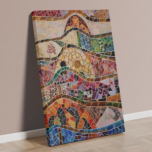 May include: A rectangular canvas print featuring a vibrant mosaic pattern with undulating horizontal bands. The design incorporates a diverse palette of red, orange, yellow, green, and blue tiles arranged in intricate, curved, and geometric shapes.