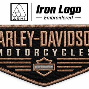 May include: A black embroidered patch featuring the text HARLEY-DAVIDSON MOTORCYCLES in tan thread. Below the text is a tan winged emblem with a central shield containing a silver bar. The patch has a tan stitched border and a pointed bottom edge.